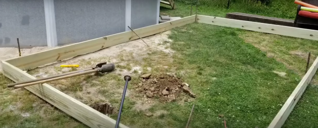 Fence off the area around your pool where the deck will be located.